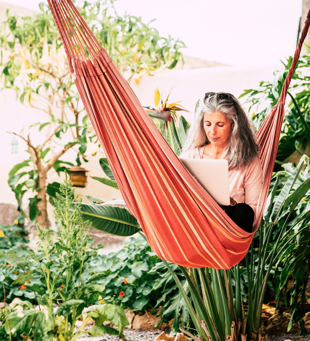 Woman in hammock with laptop