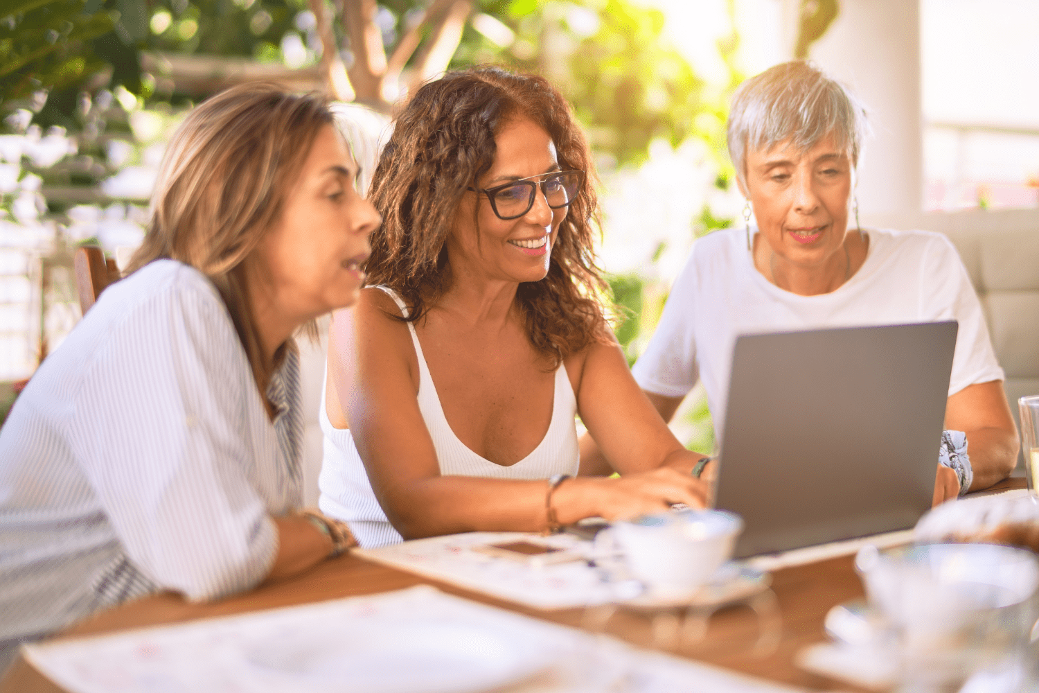 3 women at laptop